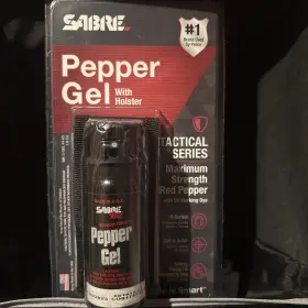 10715 SABRE Crossfire Pepper Gel Belt Clip Deploys Position