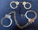American Munitions Leg Irons & Vintage Peerless Handcuffs With Keys. Fixed Price $165.00.