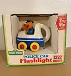 Vintage Sesame Street Ernie - Police Car Flashlight Tyco Still In Box 1993. Fixed Price $32.95.