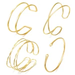 Brocc 4pcs Minimalist Gold Arm Cuff Bracelets Adjustable Coil Armband Set. Fixed Price $17.63.