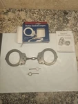 Etched-peerless Model 701 Superlite Aluminum Black Handcuffs. Fixed Price $65.00.