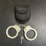 Smith & Wesson M100-1 Silver Nickel Used Handcuffs One Key With Holster. Fixed Price $30.79.